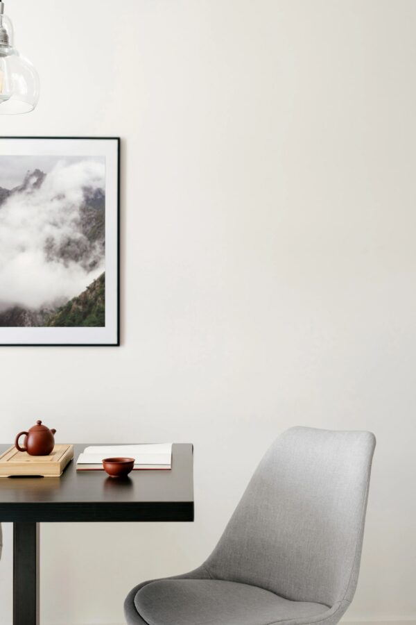 Modern dining space featuring a minimalist design with wooden accents